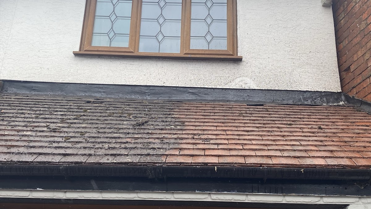 Roof clean in progress, half done